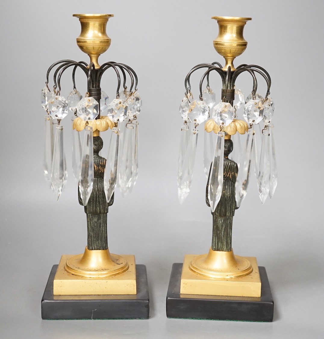 A pair of figural lustre drop candlesticks - 29cm tall